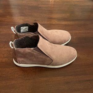Woman’s Olukai shoes.
